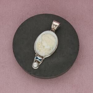 sterling silver topaz & carved mother of pearl silhouette pendant